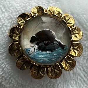 Elegant Gold and Black Animal Brooch